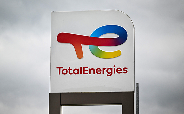 This photograph taken on October 5, 2022, shows a logo of Total Energies at a gas station in Genech, northern France. French energy group TotalEnergies reported on Thursday a drop in net profit in the second quarter as oil and gas prices have fallen from the highs they reached following Russia's invasion of Ukraine (AFP photo)