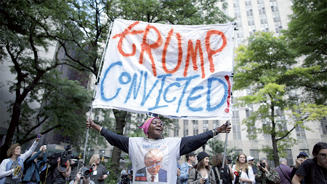 People react after former US President and Republican presidential candidate Donald Trump was convicted in his criminal trial outside of Manhattan Criminal Court in New York City, on Thursday (AFP photo)