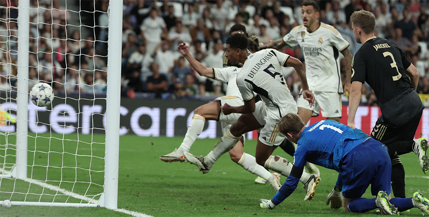 Real Madrid's English midfielder #5 Jude Bellingham scores his team's first goal during the UEFA Champions League 1st round day 1 group C football match between Real Madrid and Union Berlin at the Santiago Bernabeu Stadium in Madrid on Wednesday (AFP photo)