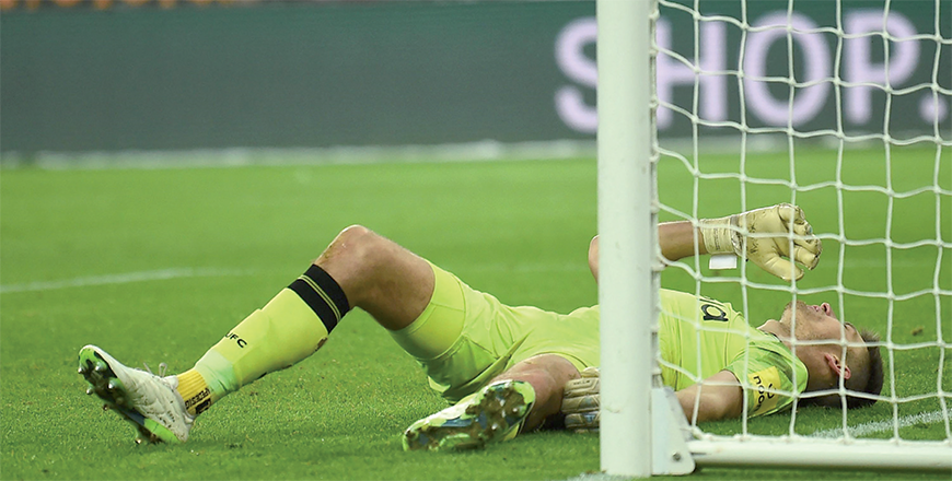Newcastle United’s English goalkeeper #22 Nick Pope reacts after picking up an injury during the English Premier League football match between Newcastle United and Manchester United at St James’ Park in Newcastle-upon-Tyne, north east England, on Saturday (AFP photo)
