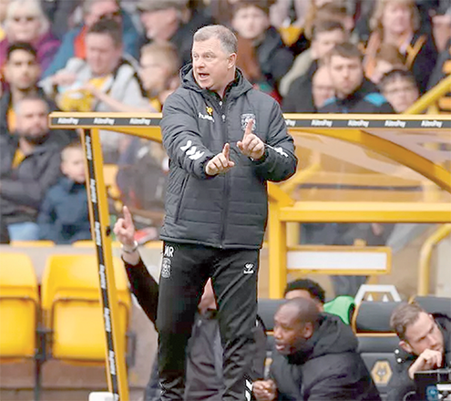 Coventry City’s English manager Mark Robins looks on during the English FA Cup quarter-final football match between Wolverhampton Wanderers and Coventry City at the Molineux Stadium in Wolverhampton, central England on March 16 (AFP photo)