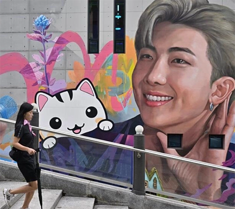 A mural in Goyang depicts BTS member RM. The K-pop juggernaut are on 'hiatus' due to members doing military service but all have renewed their contract (AFP photo)