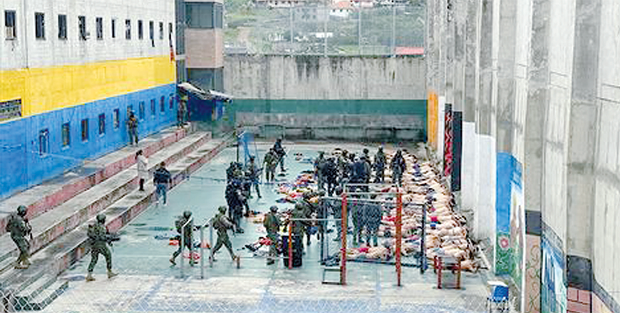 Handout photo released by the Ecuadorean armed forces showing security forces keeping watch over inmates after soldiers and police forces regained control of the Turi prison in Cuenca, Ecuador, on Sunday (AFP Photo by Ecuadorean Armed Forces) 