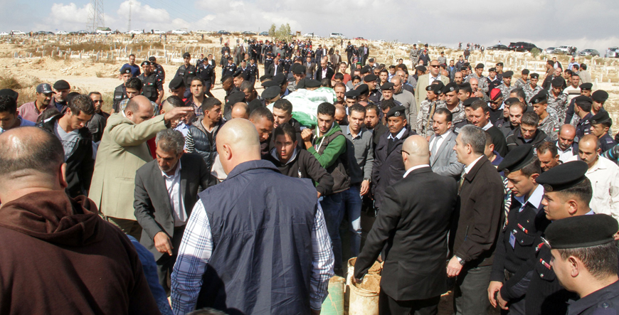 Awni Aqrabawi, one of the victims of Monday’s shooting at a police training facility, is laid to rest in Zarqa’s Hashemiyeh cemetery on Wednesday (Photo by Osama Aqarbeh)