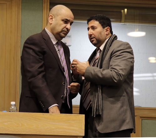 MP Tarek Khoury speaks to a fellow deputy during a Lower House session on Wednesday (Photo by Osama Aqarbeh)