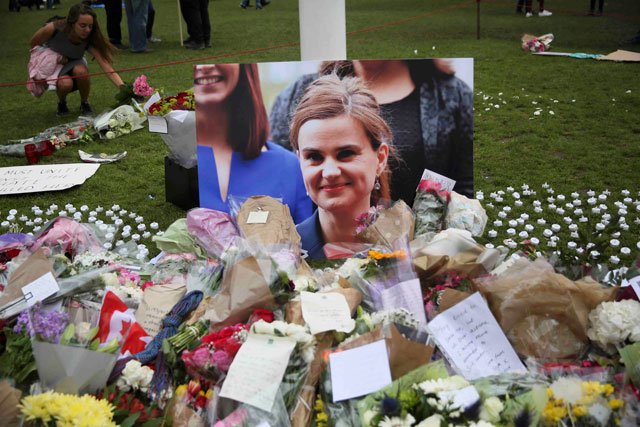 Tributes in memory of murdered Labour Party MP Jo Cox, who was shot dead in Birstall, are left at Parliament Square in London, Britain, on Saturday (Reuters photo)
