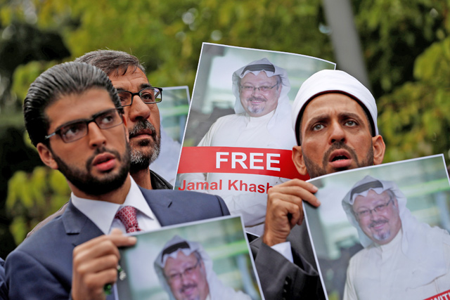 Human rights activists and friends of Saudi journalist Jamal Khashoggi hold his pictures during a protest outside the Saudi Consulate in Istanbul, Turkey, on October 8 (Reuters photo)