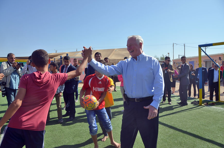 Petra photo Canada's Governor General David Johnston interacts with a Syrian refugee at the Zaatari camp on Sunday (Photo by Muath Freij)