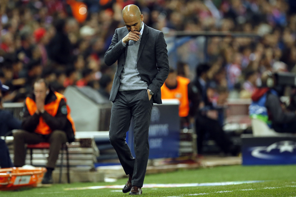 Bayern head coach Pep Guardiola reacts during the Champions League 1st leg semifinal match between Atletico Madrid and Bayern Munich at the Vicente Calderon Stadium in Madrid, Spain, on Wednesday (AP photo)