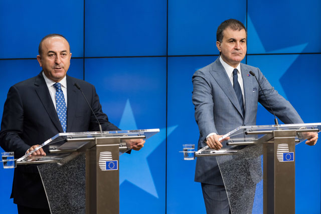Turkey’s EU Affairs Minister Omer Celik (right) and Foreign Minister Mevlut Cavusoglu address the media after an EU Turkey Accession Intergovernmental Conference at the EU Council building in Brussels, on Thursday (AP photo)