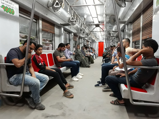 People ride a train at a metro station in the Egyptian capital, Cairo, on May 28 (AFP photo)