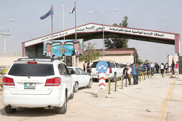 Passenger vehicles wait in line to enter Syria after the Jaber/Nasib crossing was reopened last year (JT file photo)