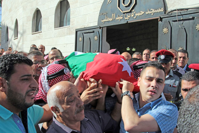 Mourners participate in the funeral of Corporal Omar Hiyari, who was laid to rest in Salt on Monday (Photo by Osama Aqarbeh)