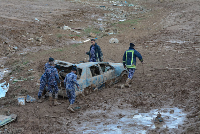 Members of search and rescue operations look for missing people in Madaba on Saturday, in the aftermath of flashfloods that hit the Kingdom during the weekend (Photo by Amjad Ghsoun)