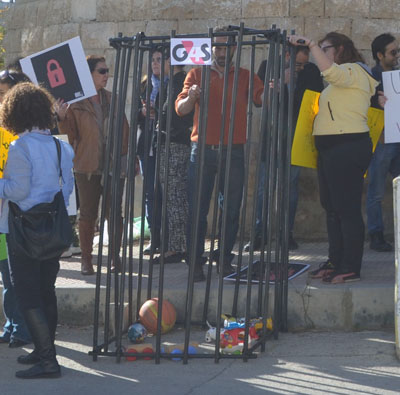 Activists gather outside UNDP's premises in Amman on Sunday (Photo by Muath Freij)