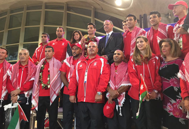 HRH Prince Feisal, president of the Jordan Olympic Committee, poses for a group photo with members of the Jordanian Olympic delegation upon their arrival at the Queen Alia International Airport on Tuesday  (Photo by Muath Freij)