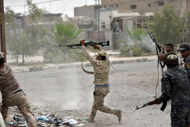 Iraqi government forces clash with Daesh militants in Fallujah on Saturday as they hunt down holdout terrorists after retaking the city   (AFP photo )