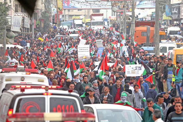 Palestinians stage a demonstration against US President Donald Trump’s recognition of Jerusalem as Israel’s capital, near the Kalandia checkpoint in Ramallah, the West Bank, on Wednesday (Anadolu Agency  photo)