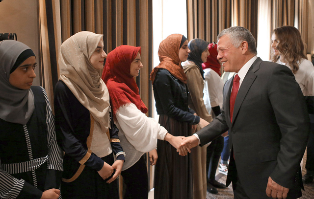 Their Majesties King Abdullah and Queen Rania meet with top achievers in the General Secondary Education Certificate Examination  on Wednesday (Photo courtesy of Royal Court)