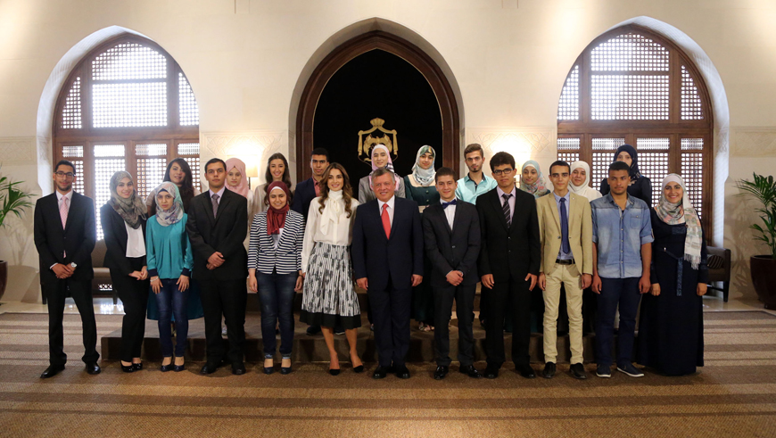 Their Majesties King Abdullah and Queen Rania with General Secondary Education Certificate Examination graduates at Al Husseiniya Palace on Sunday (Photo courtesy of Royal Court)