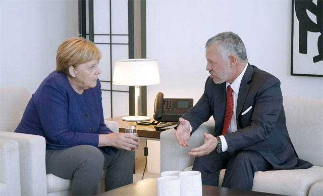   His Majesty King Abdullah holds talks with German Chancellor Angela Merkel in Berlin on Tuesday (Photo courtesy of Royal Court)