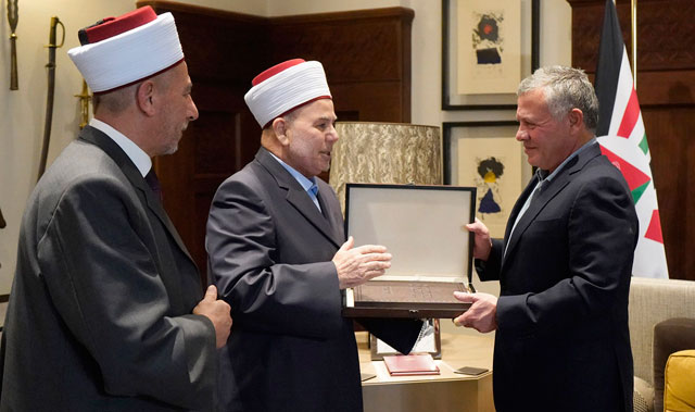 His Majesty King Abdullah receives the 2017 annual report of Sharia courts from Chief Islamic Justice Abdul Kareem Khasawneh and President of the Higher Sharia Court Kamal Smadi at Al Husseineya Palace on Monday (Photo courtesy of Royal Court)