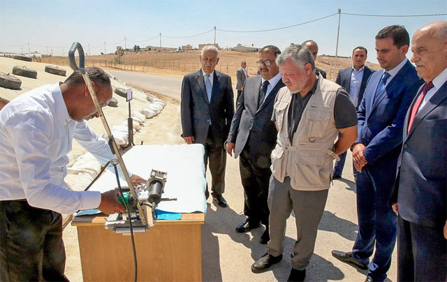His Majesty King Abdullah visits the Ghabawi horizontal bunker silos for grain storage on Sunday (Photo courtesy of Royal Court)