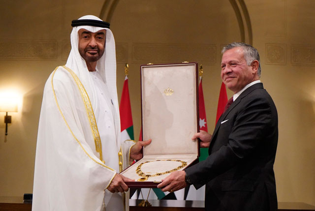 His Majesty King Abdullah presents Abu Dhabi Crown Prince and Deputy Supreme Commander of the UAE Armed Forces Sheikh Mohammad Bin Zayed Al Nahyan with the Sharif Hussein Bin Ali Collar, the Kingdom’s highest civil order, on Tuesday (Photo courtesy of Royal Court)