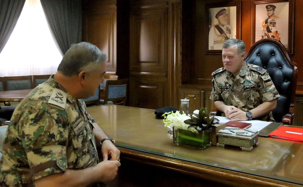 His Majesty King Abdullah, the Supreme Commander of the Jordan Armed Forces-Arab Army, is received by Chairman of the Joint Chiefs-of-Staff Lt. Gen. Mahmoud Freihat as he visits the army headquarters on Monday (Petra photo)