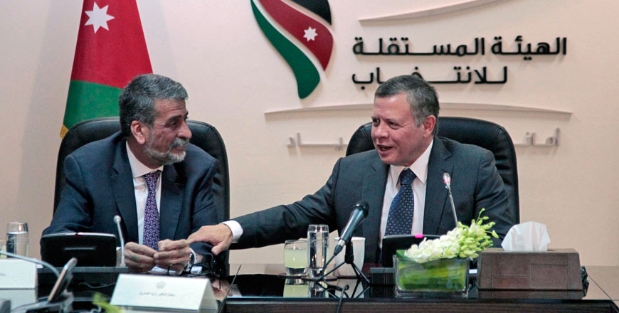 His Majesty King Abdullah speaks at a meeting with the Independent Election Commission’s board of commissioners during a visit to the IEC headquarters in Amman on Sunday (Photo courtesy of Royal Court)