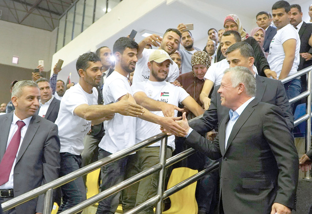 His Majesty King Abdullah meets with Jordanin workers during a ceremony held by the Greater Amman Municipality on the occasion of Labour Day on Wednesday (Photo courtesy of Royal Court)