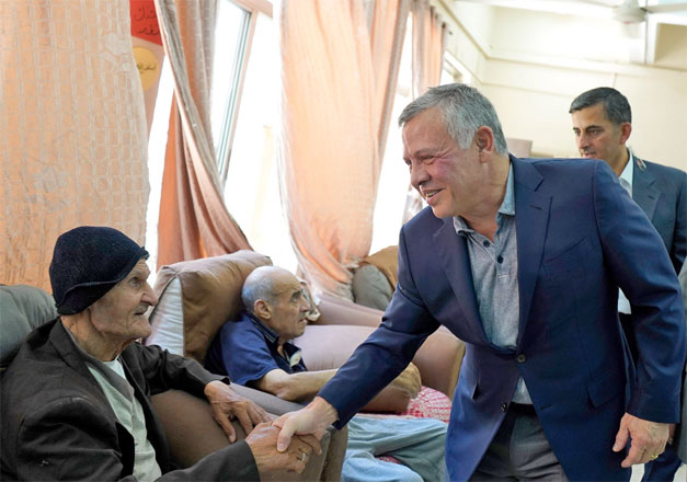 His Majesty King Abdullah visits the Golden Age Home for the elderly at the White Beds Society in Juweideh on Monday (Photo courtesy of Royal Court)