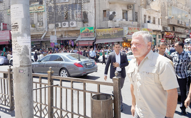 His Majesty King Abdullah makes his way to the historic Al Husseini Mosque in downtown Amman, on Monday, to check on the aftermath of a recent fire that broke out in parts of the mosque (Photo courtesy of Royal Court)