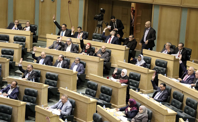 Lawmakers attend a Lower House session on Sunday (Photo by Osama Aqarbeh)