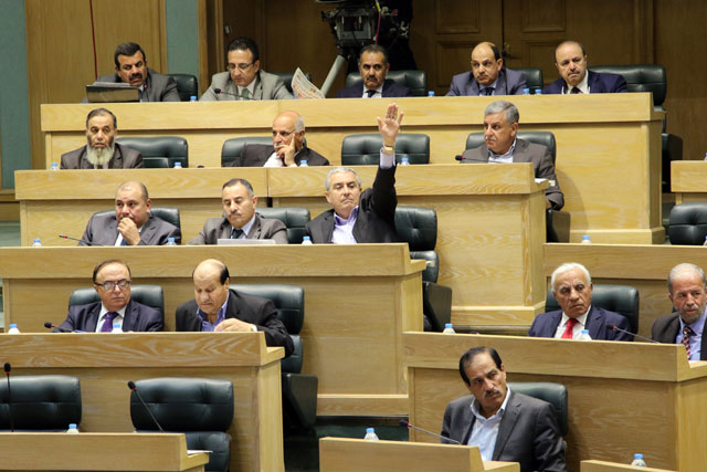 Lawmakers attend a Lower House session on Sunday (Photo by Osama Aqarbeh)