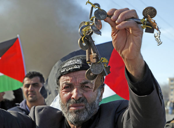 A Palestinian man holds a bunch of keys during a protest against the US decision to recognise Jerusalem as the capital of Israel on Tuesday north of Ramallah in the Israeli-occupied West Bank (AFP photo)