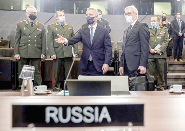 Russian Deputy Foreign Minister Alexander Grushko (right) and NATO Secretary General Jens Stoltenberg (centre) arrive to attend the NATO-Russia Council at the Alliance's headquarters in Brussels, on Wednesday (AFP photo)