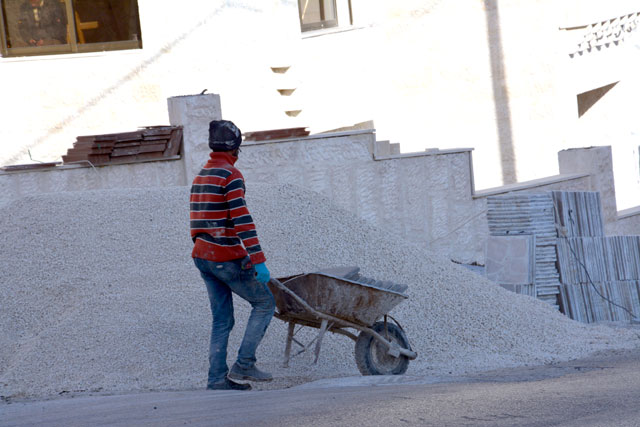 The housing developers syndicate says increasing customs duties on construction material will cause a surge in real estate prices, while the food trader syndicate says prices of essentials will not be affected (Photo by Amjad Ghsoun)