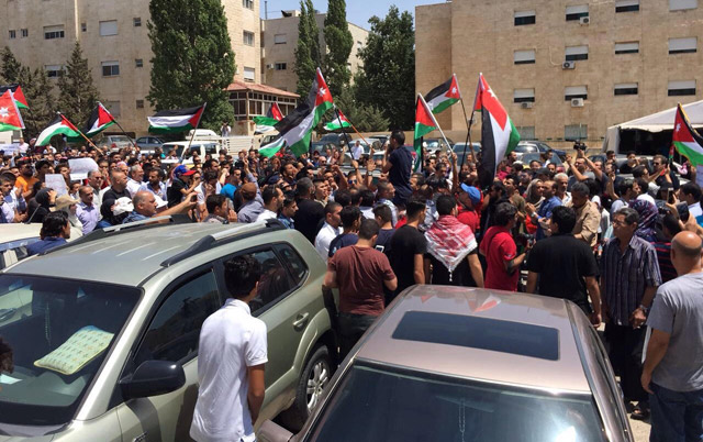 Jordanians protest the killing of two Jordanians by an Israeli security guard last Sunday in the western Amman neighbourhood of Al Rabieh on Friday  (Photo by Muath Freij)
