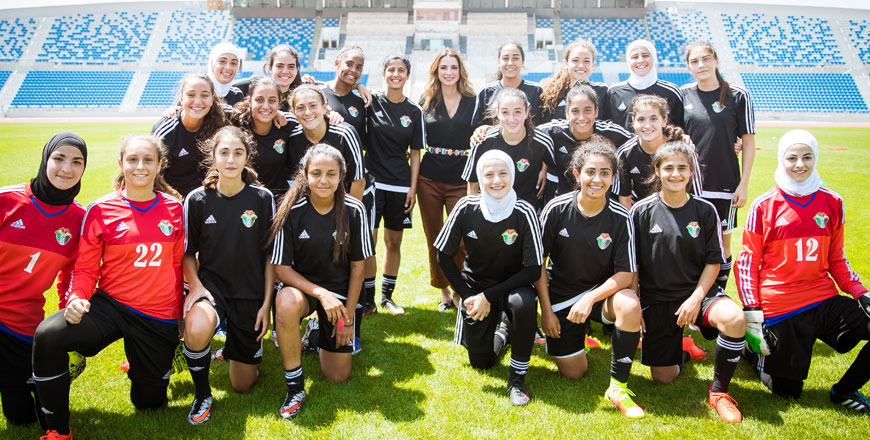 Her Majesty Queen Rania with members of the women's national U-17 team at the Amman International Stadium on Tuesday (Photo courtesy of Royal Court)