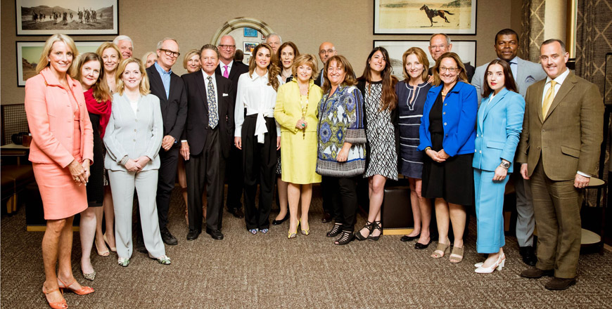 Her Majesty Queen Rania poses for a group photo with visiting friends and supporters of the Jordan River Foundation on Thursday   (Photo courtesy of the Royal Court)