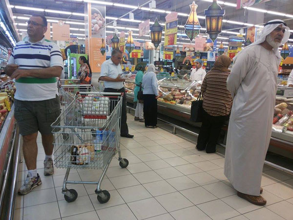 Shoppers examine products at a hypermarket in Amman last Ramadan. During the fasting month, consumption of food and beverages rises in Jordan due to a change in eating patterns (Photo by Amjad Ghsoun)