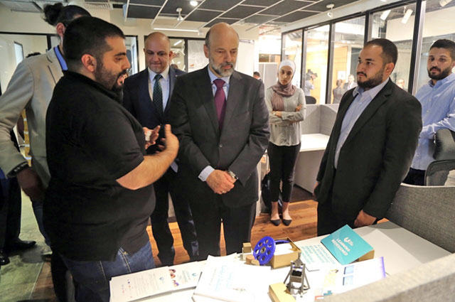Prime Minister Omar Razzaz visits companies in Irbid Development Area during a visit to the northern governorate, 80km north of Amman, on Tuesday (Petra photo)