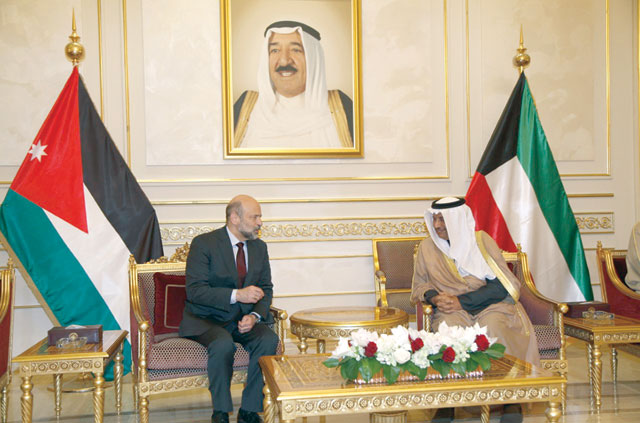 photo Prime Minister Omar Razzaz holds discussions with Kuwaiti Prime Minister Sheikh Jaber Al Mubarak Al Sabah in Kuwait City on Thursday (Petra)