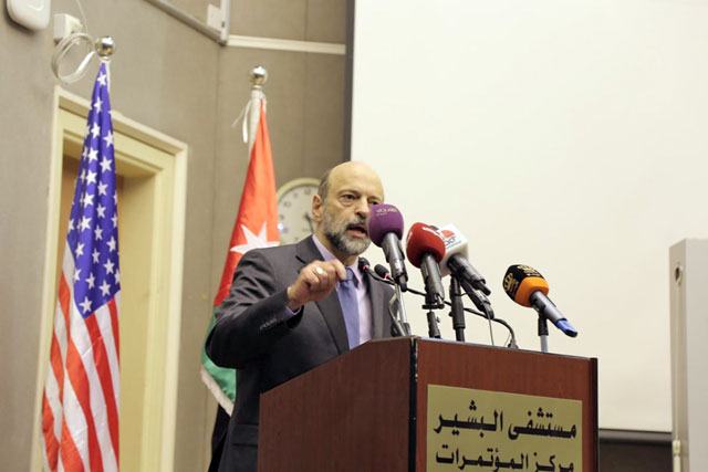 Prime Minister Omar Razzaz speaks to attendees at a ceremony to mark the opening of a new emergency building at Al Bashir Hospital in Amman on Monday (Petra photo)