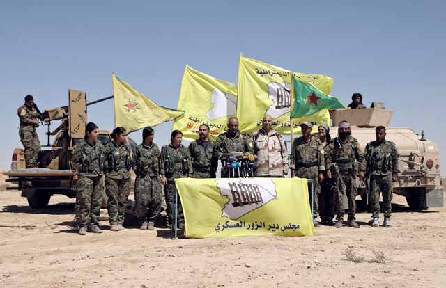 Ahmed Abu Kholeh, head of the Deir Ezzor military council which fights under the Syrian Democratic Forces, speaks during a press conference in the village of Abu Fas, Hasaka province, Syria, on Saturday (Reuters photo)
