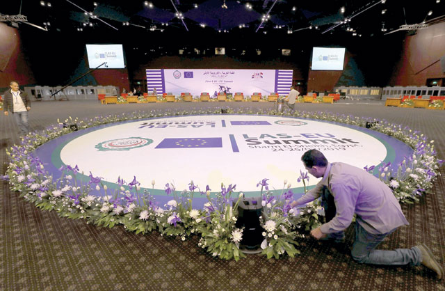 A worker prepares flowers at the International Congress Centre a day before the first EU-Arab League Summit in Sharm El Sheikh, Egypt, on Saturday  (Reuters photo)