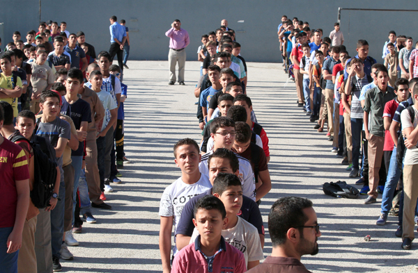 Classes started at 6,924 school across Jordan on Tuesday with the beginning of the 2015-2016 academic year (Photo by Osama Aqarbeh)