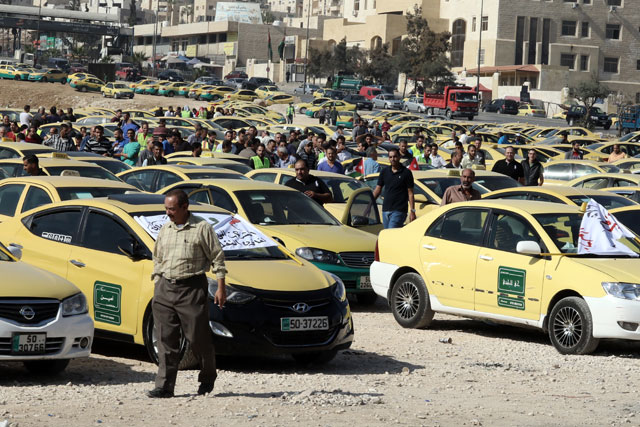 Taxi drivers hold a protest in Amman's Dahiyet Al Aqsa on Tuesday (Photo by Osama Aqarbeh)