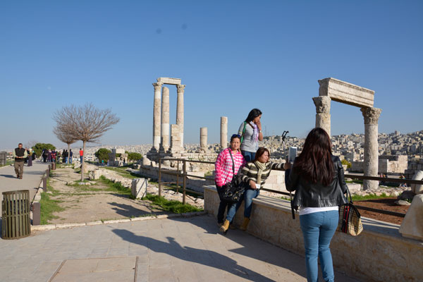 Tourists from Asia visit the Citadel in Amman's Jabal Al Qalaa neighbourhood recently (Photo by Amjad Ghsoun)